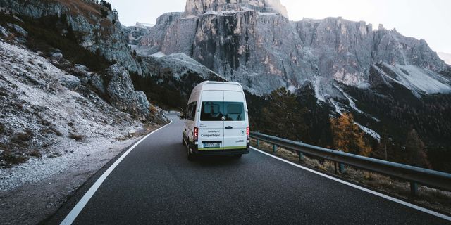 CamperBoys van driving through the mountains